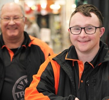 Michael Dodds enjoys his first day at Mitre 10, supported by retail manager Jan Storm.