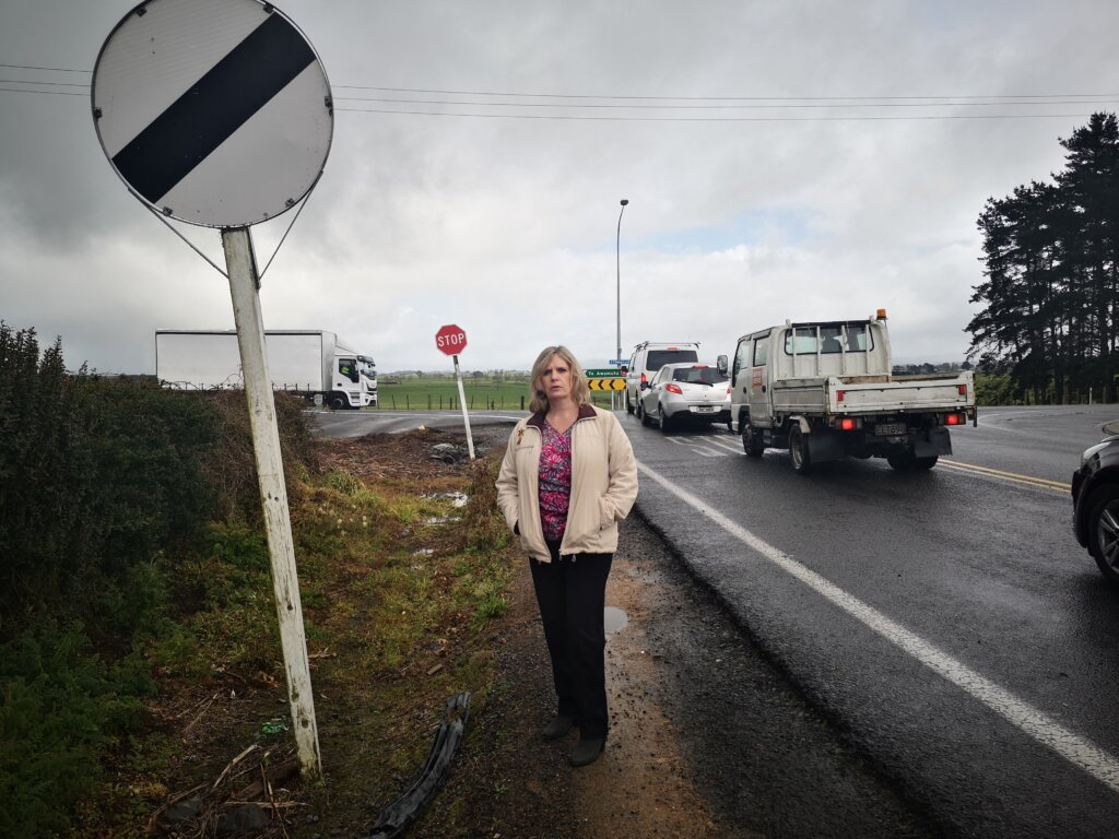 Sue Davies at the Raynes Road and SH3 intersection where a 70-year-old woman died last week in a car accident.